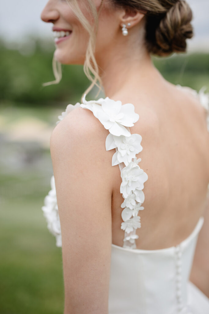 photos over the shoulder of the bride while she looks off in the distance shot by timeless wedding photographer Monika Eisenbart