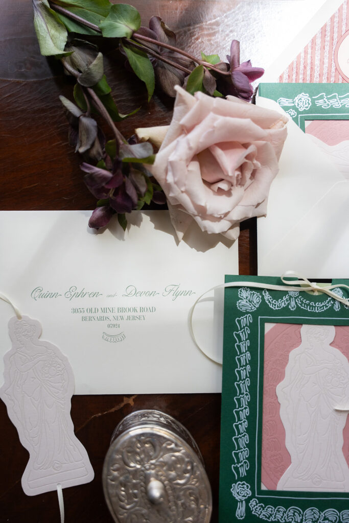 flat lay of sculpture inspired wedding stationery