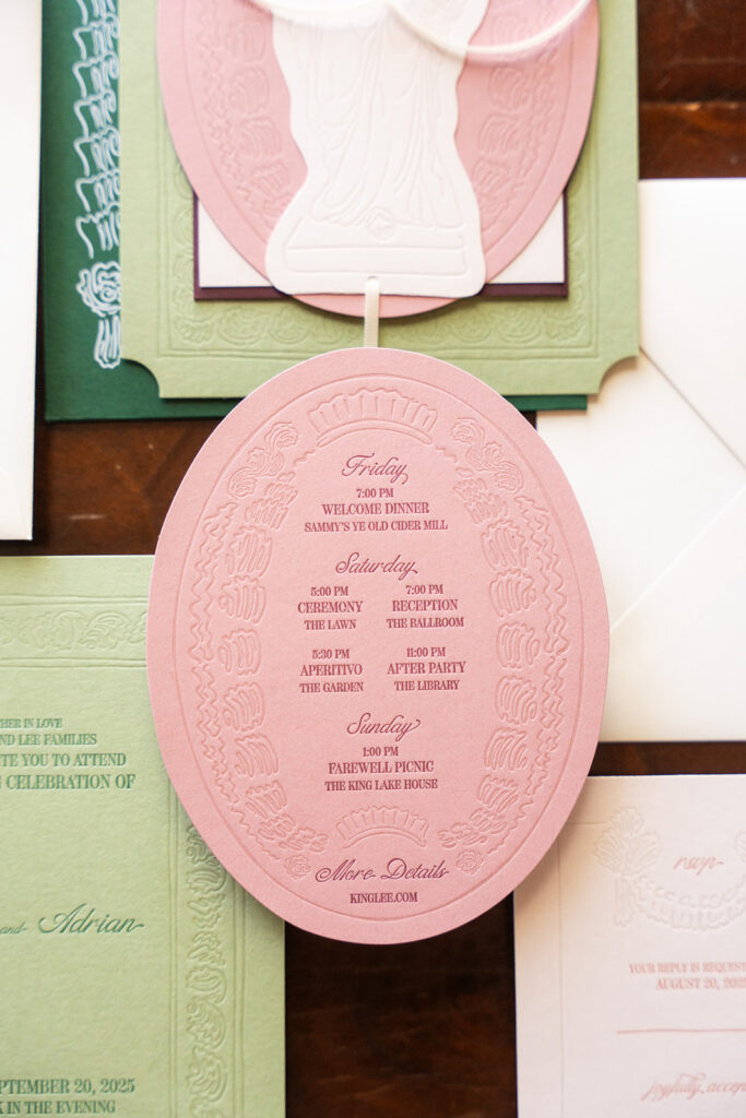 Close-up of custom wedding invitation with cut-out detailing and textured paper, designed by The Gold Edit.