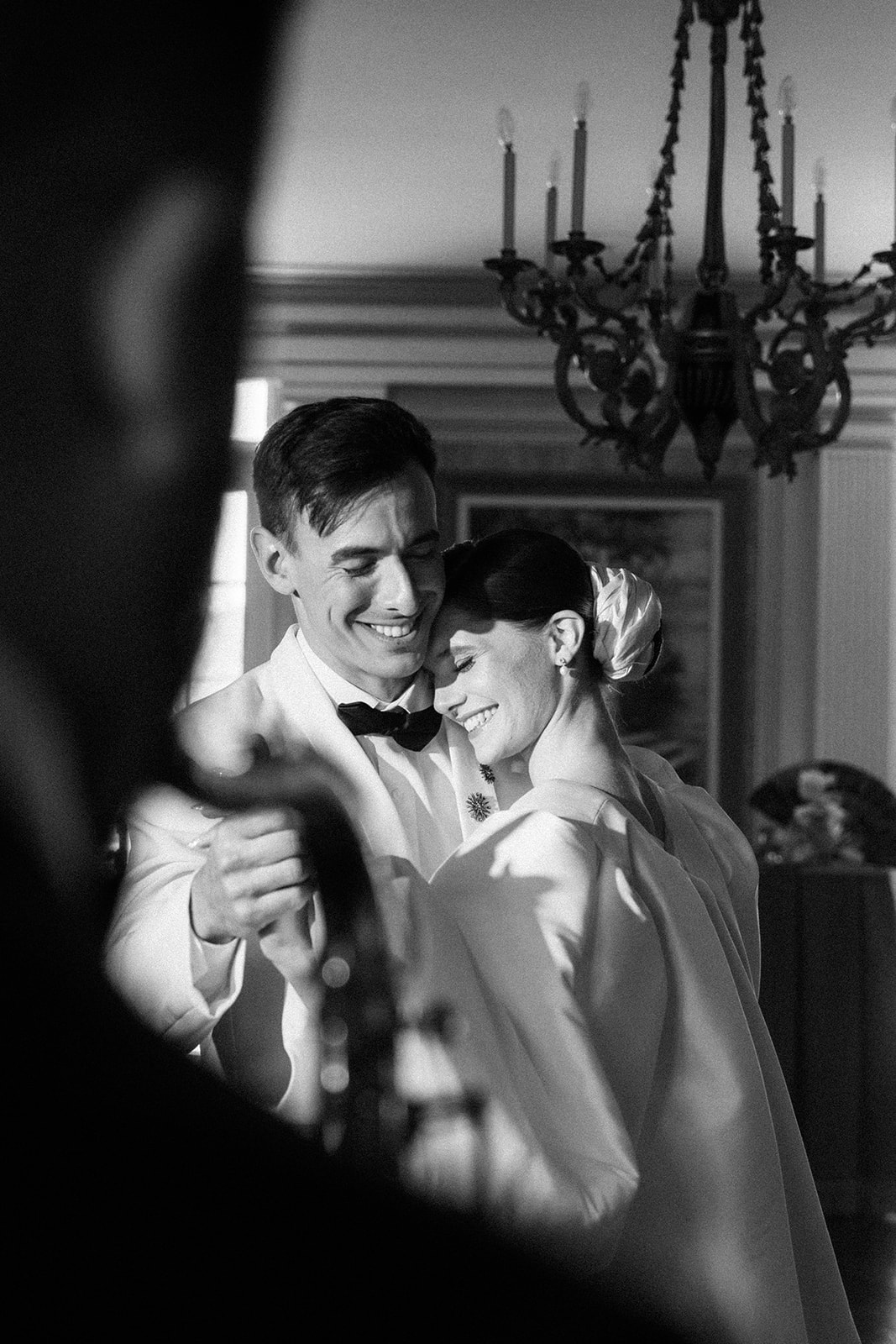 bride and groom sharing a happy moment while dancing a slow dance